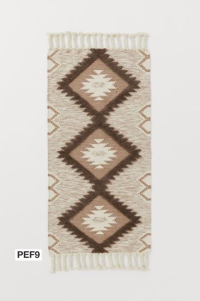 Kilim bordadas con flecos
